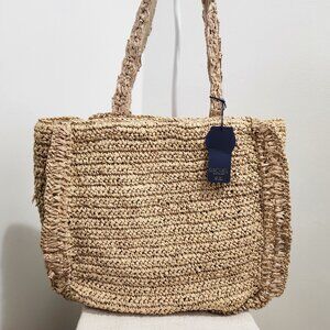 Straw bag lined by Raxhel Roy